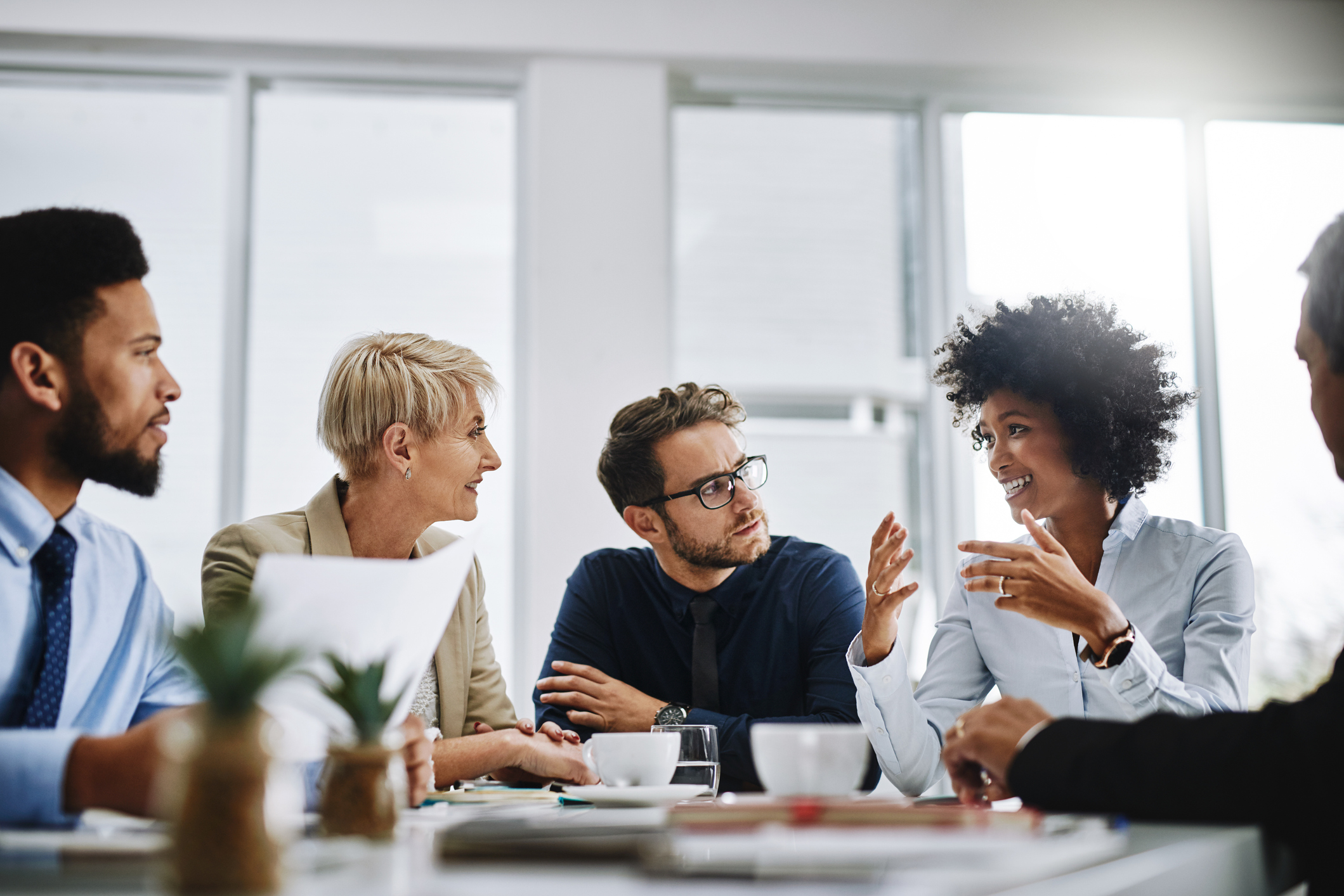 A group of businesspeople sitting together in a meeting